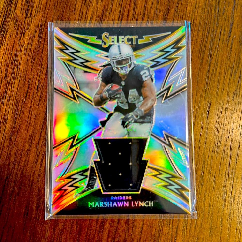 2018 Panini Select Sparks Materials Prizm #38 Marshawn Lynch /99 Oakland Raiders